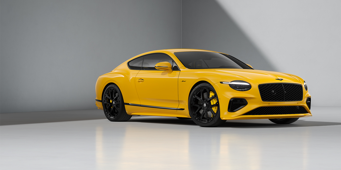 Bentley Hamburg Bentley Continental GT Speed coupe in Monaco Yellow paint and 22" Ten spoke sport wheels - front 3/4