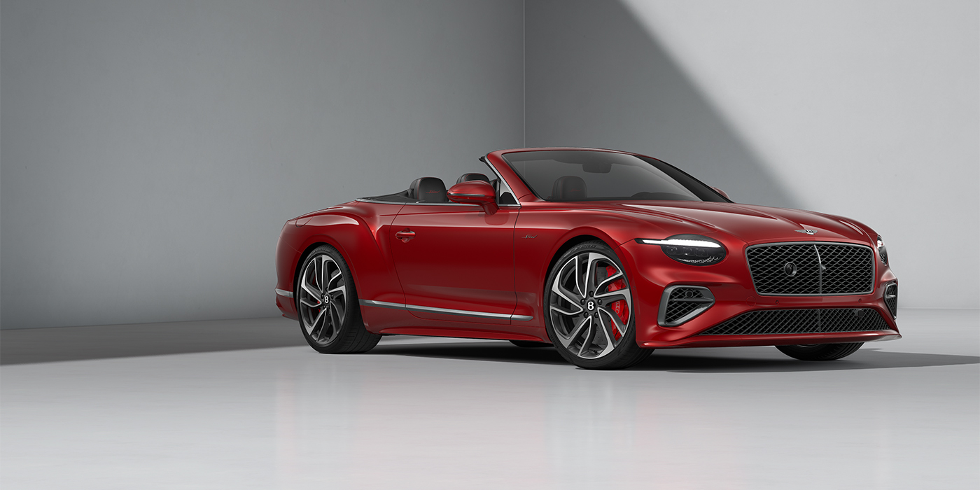 Bentley Hamburg Bentley Continental GTC Speed convertible in Dragon Red paint and 22" swept spoke wheels - front 3/4