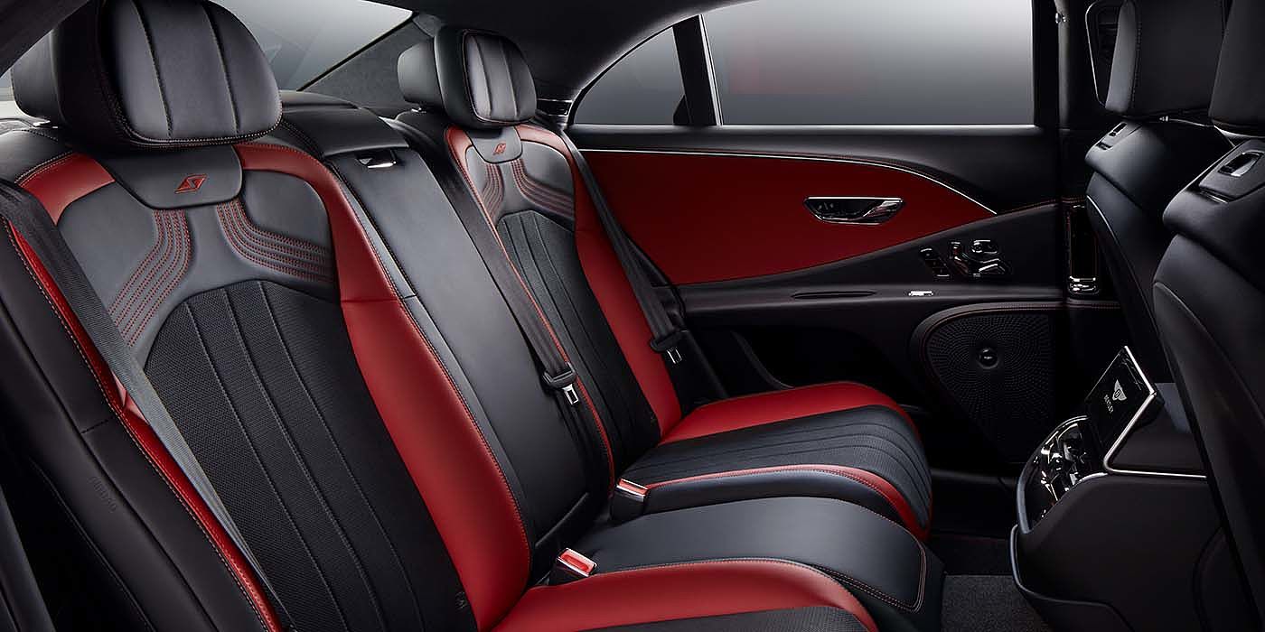 Bentley Hamburg Bentley Flying Spur S sedan rear interior in Beluga black and Hotspur red hide with S stitching