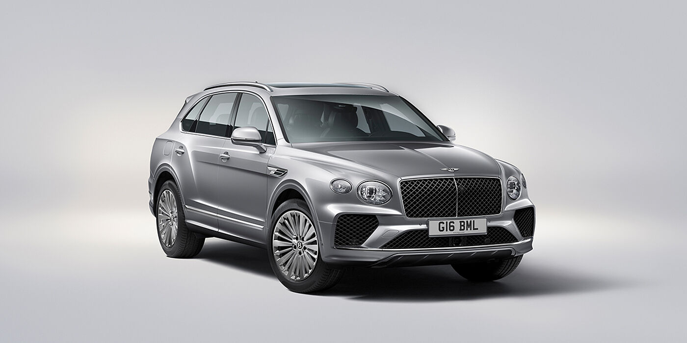 Bentley Hamburg Bentley Bentayga luxury SUV front three quarter view in Moonbeam paint with matrix grille and 21″ 5 spoke painted wheels