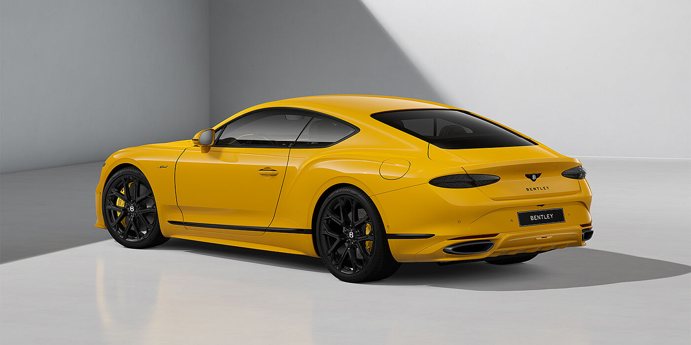 Bentley Hamburg Bentley Continental GT Speed coupe in Monaco Yellow paint and 22" Ten spoke sport wheels - rear 3/4