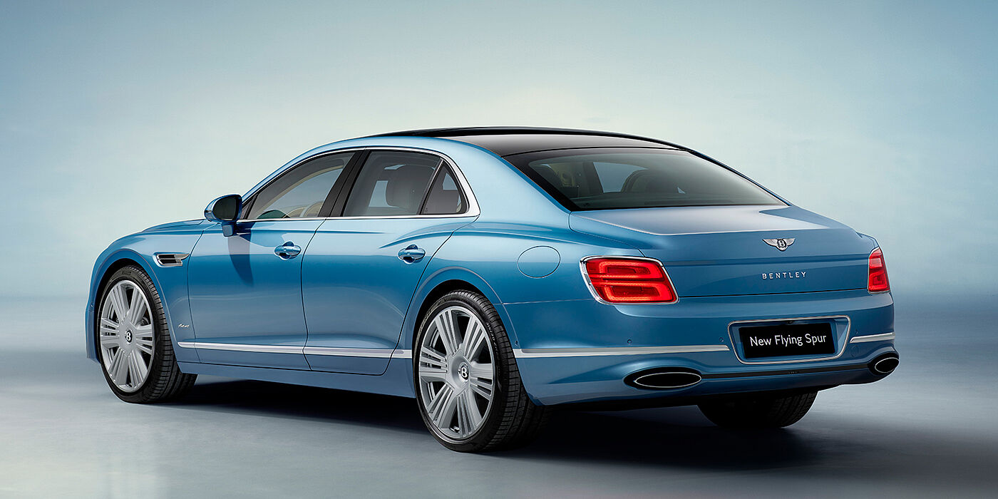Bentley Hamburg New Bentley Flying Spur Azure sedan rear view in Light windsor blue by Mulliner paint with 22 inch Azure wheels and chrome exterior details