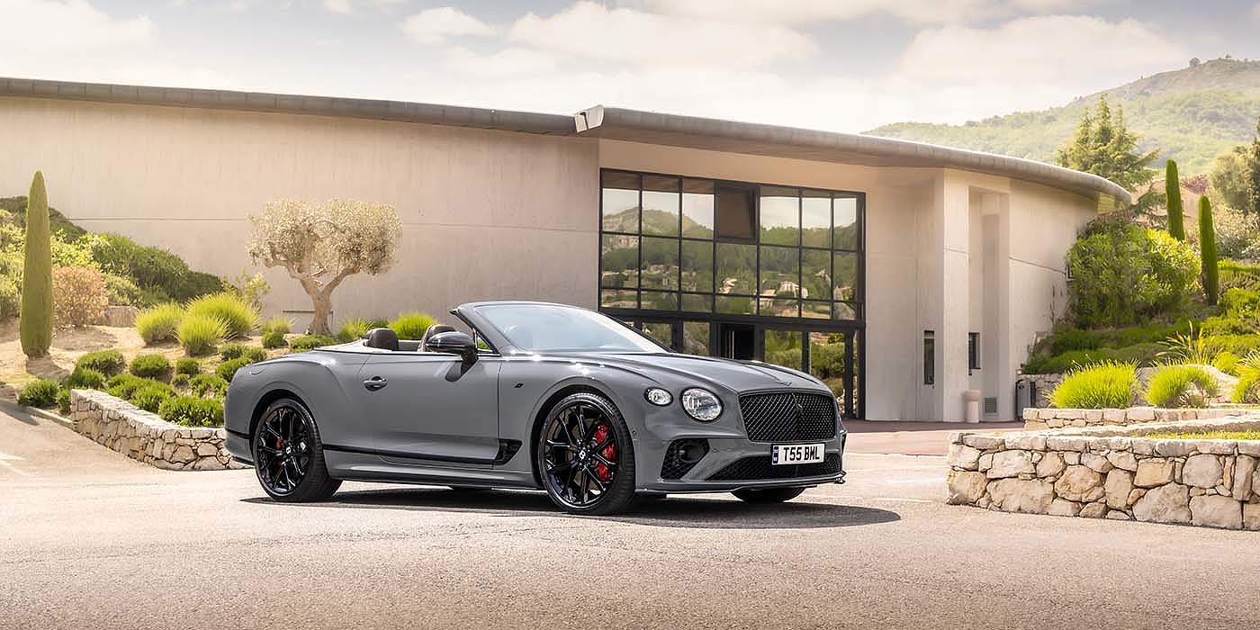 Bentley Hamburg Bentley Continental GTC S convertible in Cambrian Grey paint front 34 static near house