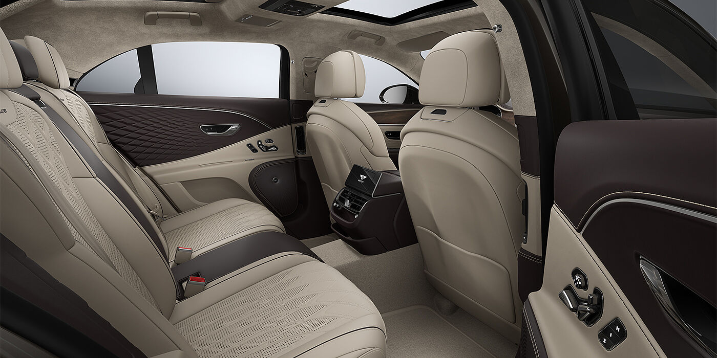 Bentley Hamburg New Bentley Flying Spur Azure sedan rear interior in Portland and Burnt Oak hides with Open Pore Crown Cut Walnut veneer