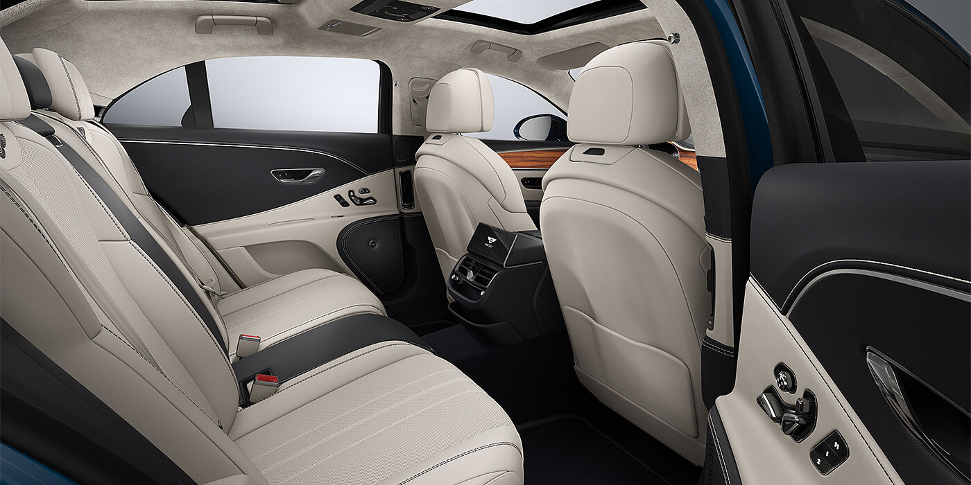 Bentley Hamburg New Bentley Flying Spur sedan rear interior in Linen and Imperial Blue hides with Open Pore Koa veneer