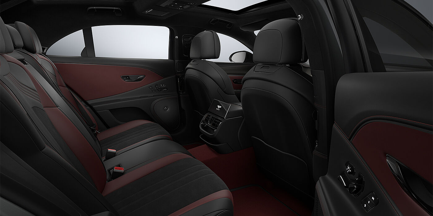 Bentley Hamburg New Bentley Flying Spur S sedan rear interior in Cricket Ball red  and Beluga black hides with High Gloss Carbon Fibre veneer