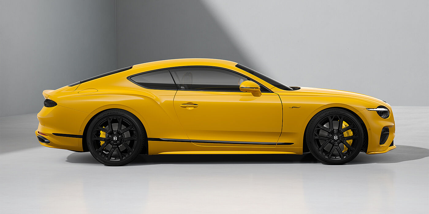 Bentley Hamburg Bentley Continental GT Speed coupe in Monaco Yellow paint and 22" Ten spoke sport wheels - profile