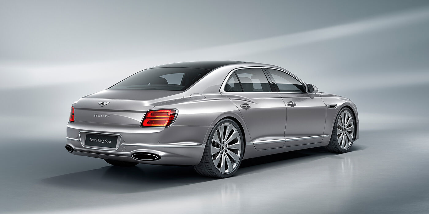 Bentley Hamburg New Bentley Flying Spur sedan rear view in Silverlake paint with ten spoke wheels and chrome matrix grille