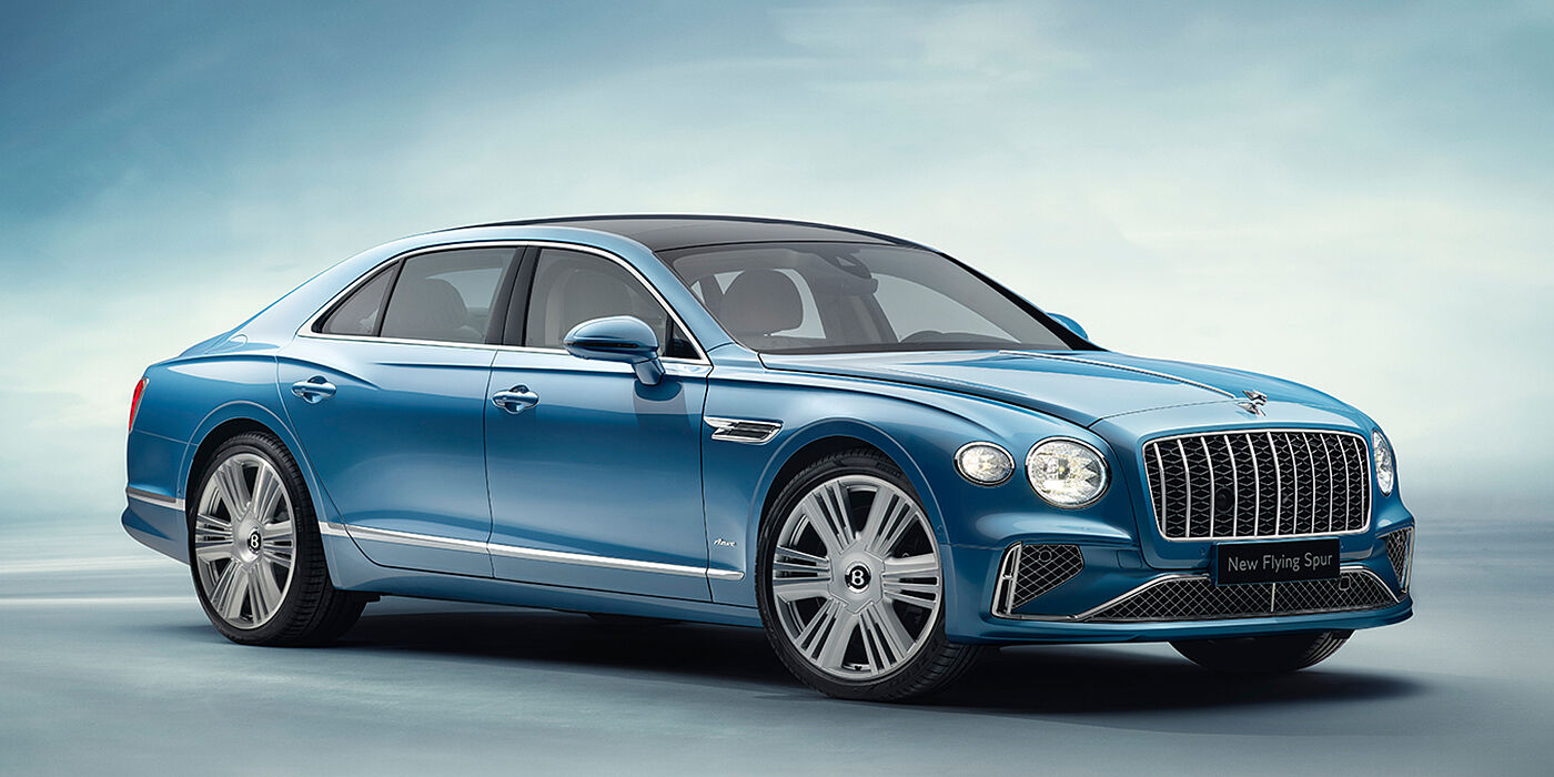 Bentley Hamburg New Bentley Flying Spur Azure sedan front view in Light windsor blue by Mulliner paint with 22 inch Azure wheels and chrome exterior details