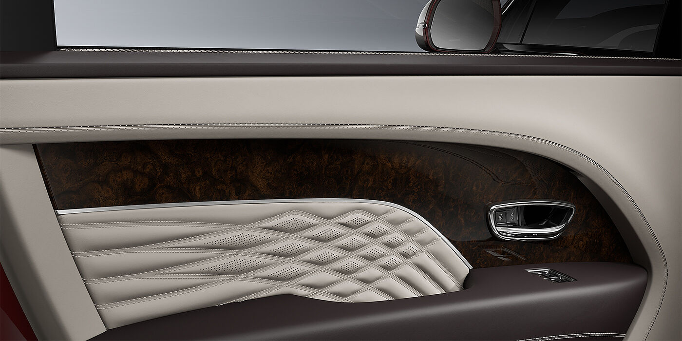 Bentley Hamburg Bentley Bentayga EWB Azure SUV door interior detail in Linen and Burnt Oak hides with Dark Stained Burr Walnut veneer
