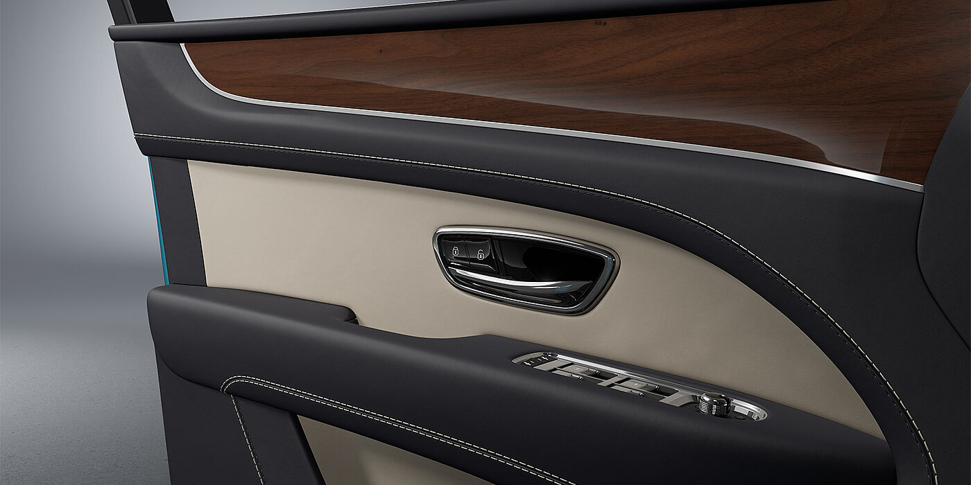 Bentley Hamburg Bentley Bentayga EWB SUV door interior detail in Portland and Imperial Blue hides with Crown Cut Walnut veneer