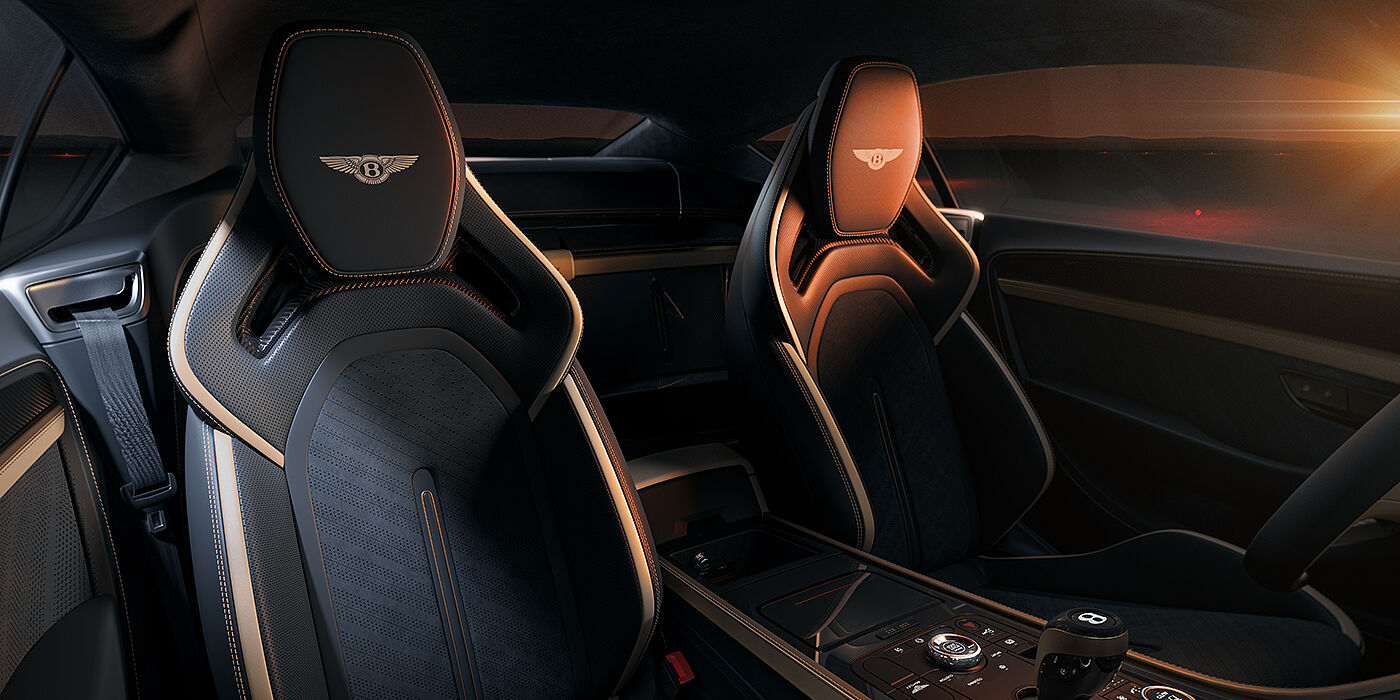 Bentley Hamburg Bentley Supersports rear interior with Supersports seats in Camel and Beluga black hides hide and high gloss carbon fibre veneer