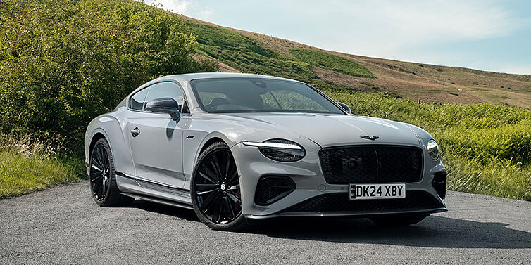 Bentley Hamburg Bentley Continental GT front three quarter with Carbon Fibre Specification parked on road.