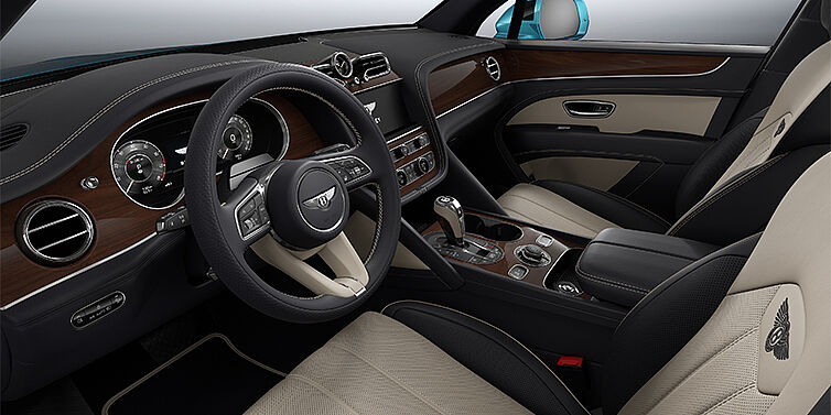Bentley Hamburg Bentley Bentayga EWB SUV front interior in Portland and Imperial Blue hides with Crown Cut Walnut veneer