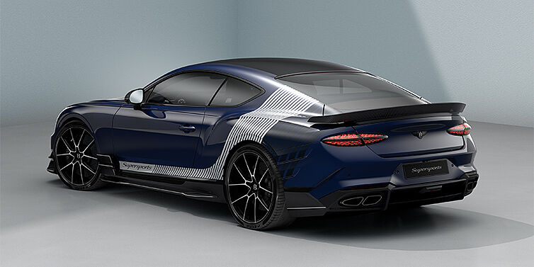 Bentley Hamburg Bentley Supersports rear three quarter in "Skies" Design theme with Electric Blue paint finish and Arctica white and Oxford blue paint stripes across the rear haunch.