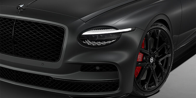 Bentley Hamburg New Bentley Flying Spur S sedan head lamp against Anthracite Satin paint with  22" Sports wheel
