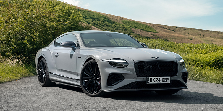 Bentley Hamburg Bentley Continental GT front three quarter with Carbon Fibre Specification parked on road.