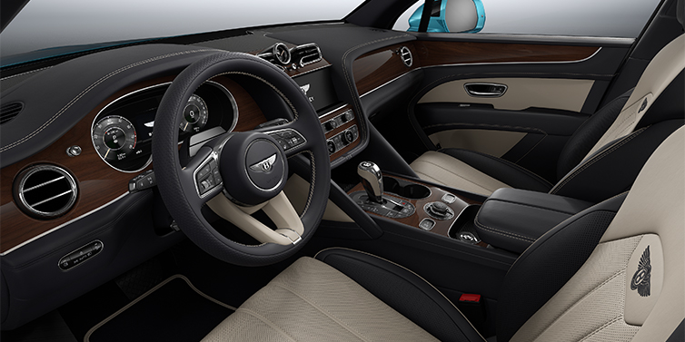 Bentley Hamburg Bentley Bentayga EWB SUV front interior in Portland and Imperial Blue hides with Crown Cut Walnut veneer