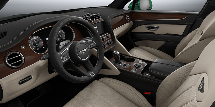 Bentley Hamburg Bentley Bentayga SUV front interior in Portland and Beluga black hides with Crown Cut Walnut veneer