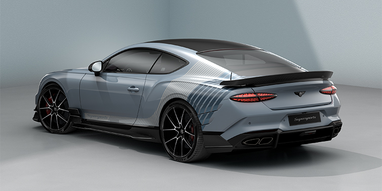 Bentley Hamburg Bentley Supersports rear three quarter in "Daybreak" Design theme with Jetstream blue paint and Arctica white and Portofino blue paint stripes across the rear haunch.