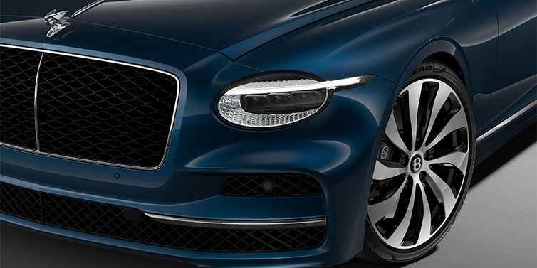 Bentley Hamburg New Bentley Flying Spur sedan head lamp against Marlin blue paint with 22" Ten Spoke Black Painted and Bright Machined wheel