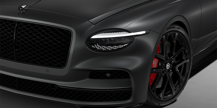Bentley Hamburg New Bentley Flying Spur S sedan head lamp against Anthracite Satin paint with  22" Sports wheel