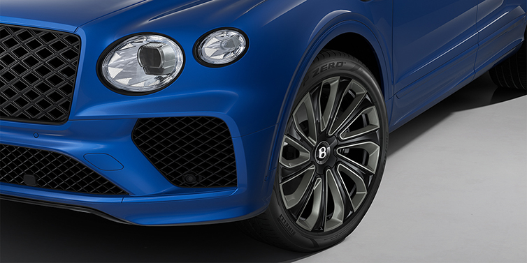 Bentley Hamburg Bentley Bentayga Artenara Edition SUV front detail in Sequin Blue paint and 22" Mulliner Gloss Black wheels front 3/4