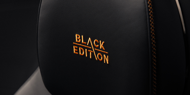 Bentley Hamburg Bentley Continental GT coupe seat headrest Black Edition stitched emblem in Mandarin colour against Beluga black hide