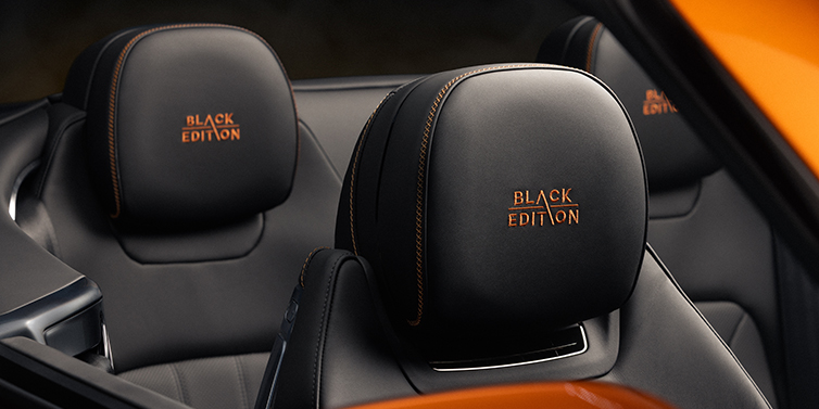 Bentley Hamburg Bentley Continental GTC Black Edition convertible seat detail with Beluga black hide and Mandarin emblem stitching