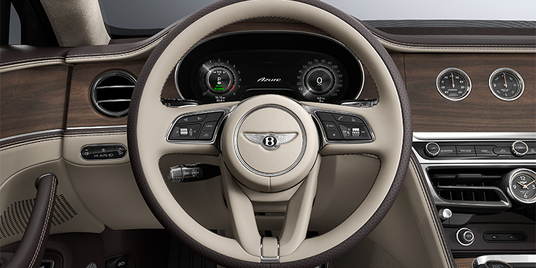 Bentley Hamburg New Bentley Flying Spur Azure sedan steering wheel and dash in Portland and Burnt Oak hides and Open Pore Crown Cut Walnut veneer